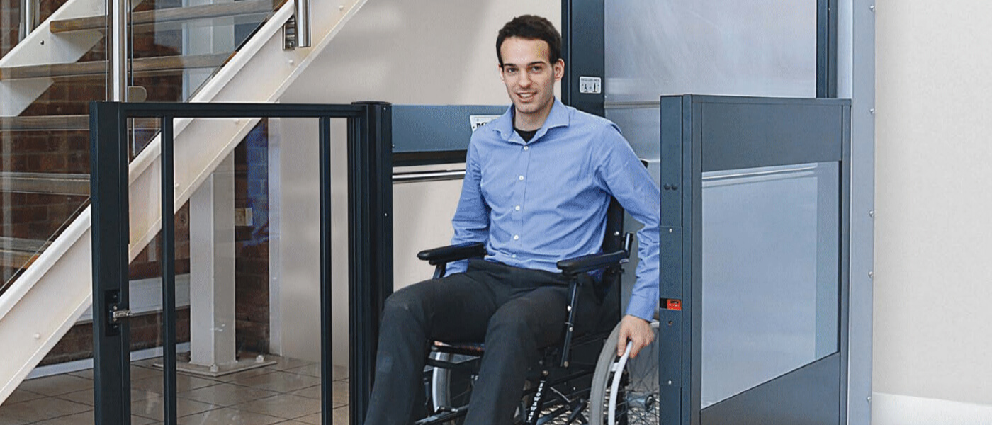 Person in wheelchair on platform lift